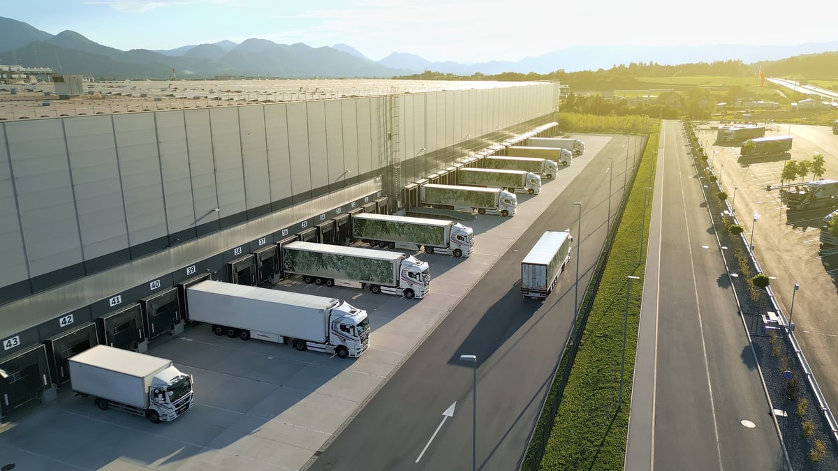 Distribution warehouse with trucks lined up at loading docks